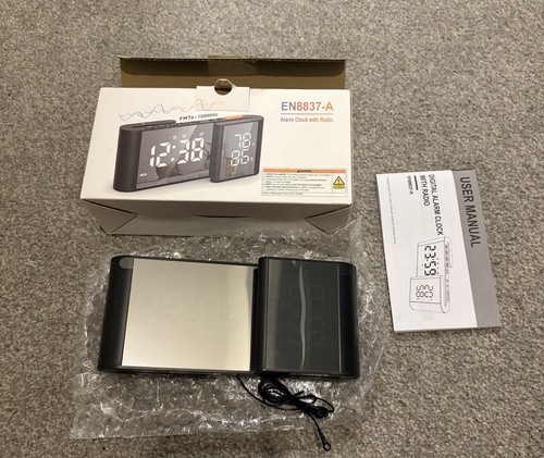 Digital alarm clock with - alarm,